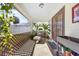 Cozy screened porch with lounge chair and potted plants at 4028 Dover E Dr, Bradenton, FL 34203