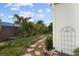 Pathway through the backyard landscape at 4028 Dover E Dr, Bradenton, FL 34203