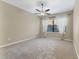 Bright bedroom with neutral walls and carpeting at 4207 Overture Cir, Bradenton, FL 34209