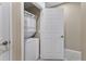 Laundry closet with stackable washer and dryer at 4207 Overture Cir, Bradenton, FL 34209