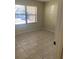 Bright bedroom with tile flooring and window with blinds at 435 30Th W Ave # D103, Bradenton, FL 34205