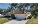 Single Gathering home with driveway and American flag at 4569 35Th Avenue E Cir, Palmetto, FL 34221