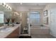 Relaxing bathroom with a soaking tub, walk-in shower and double vanity at 4569 35Th Avenue E Cir, Palmetto, FL 34221