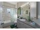 Clean bathroom with shower/tub combo, vanity, and linen closet at 4569 35Th Avenue E Cir, Palmetto, FL 34221