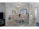 Formal dining area with glass-top table and six chairs at 4569 35Th Avenue E Cir, Palmetto, FL 34221