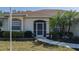 House exterior featuring a walkway, landscaping, and a screened entryway at 4569 35Th Avenue E Cir, Palmetto, FL 34221