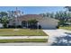 One-story home with a two-car garage, well-maintained lawn and American flag at 4569 35Th Avenue E Cir, Palmetto, FL 34221