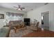 Gathering room with a wood floor, comfortable seating, and a view to another room at 4569 35Th Avenue E Cir, Palmetto, FL 34221