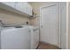 Laundry room with washer, dryer, and storage cabinets at 4569 35Th Avenue E Cir, Palmetto, FL 34221