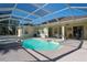 Relaxing screened-in pool area with spa and patio furniture at 4569 35Th Avenue E Cir, Palmetto, FL 34221