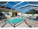 Inviting pool and spa area with screened enclosure at 4569 35Th Avenue E Cir, Palmetto, FL 34221