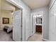 Hallway with doors to bedroom, bathroom, and laundry area at 5548 Palmer Cir # 102, Bradenton, FL 34211