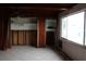 Living room with built in shelving and large window at 6203 Marina Dr, Holmes Beach, FL 34217