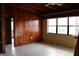 Spacious living room with wood paneling and tiled floors at 6203 Marina Dr, Holmes Beach, FL 34217