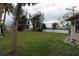 Spacious side yard with grassy area and a clothesline at 6203 Marina Dr, Holmes Beach, FL 34217