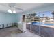 Living room under renovation, view of pool through sliding doors at 621 Emerald Ln, Holmes Beach, FL 34217