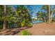 Private dock on peaceful waterway with lush foliage at 6246 Ravenwood Dr, Sarasota, FL 34243