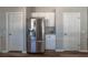 Stainless steel refrigerator in kitchen with white cabinets and hardwood floors at 6405 61St E Dr, Palmetto, FL 34221