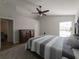 Large bedroom with king bed, ceiling fan and access to the bathroom at 6405 61St E Dr, Palmetto, FL 34221