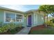 Purple front door entryway with walkway and landscaping at 6725 Roxbury Dr, Sarasota, FL 34231