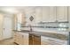 Kitchen with granite counters and stainless steel sink at 6725 Roxbury Dr, Sarasota, FL 34231