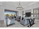 Bright and airy living room with a view of the pool area at 8540 Pavia Way, Lakewood Ranch, FL 34202