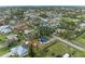 Aerial view of house and neighborhood at 875 Royal Rd, Venice, FL 34293