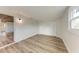 Light-filled bedroom featuring wood-look floors and built-in closet at 875 Royal Rd, Venice, FL 34293