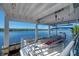 Covered seating area on a ferry boat with calm waters in the background at 875 Royal Rd, Venice, FL 34293
