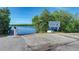 Boat ramp access at South Venice Beach with a dock and clear signage at 875 Royal Rd, Venice, FL 34293
