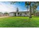 Newly renovated home with brick paver driveway and spacious lawn at 875 Royal Rd, Venice, FL 34293