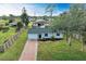 Front view of the house with brick pathway at 875 Royal Rd, Venice, FL 34293