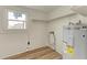 Modern kitchen with stainless steel appliances and white cabinets at 875 Royal Rd, Venice, FL 34293