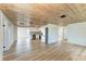 Living Room with wood-look floors and a rustic wood ceiling at 875 Royal Rd, Venice, FL 34293