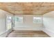 Sunroom features wood ceiling, built-in bench seating, and access to backyard at 875 Royal Rd, Venice, FL 34293