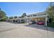 Condo building with carport parking spaces for residents at 891 Norwalk Dr # 206, Venice, FL 34292