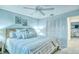 Main bedroom with ceiling fan, and ensuite bathroom access at 925 Beach Rd # 408, Sarasota, FL 34242