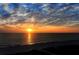 Stunning ocean sunset view over the beach at 1065 Gulf Of Mexico Dr # 104, Longboat Key, FL 34228