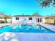 Inviting swimming pool with solar panels and patio at 1097 Willis Ave, Sarasota, FL 34232