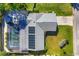 Top-down view of a home with a pool and solar panels on the roof at 1107 60Th W St, Bradenton, FL 34209