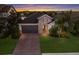 One-story home with a lake view in a residential neighborhood at 12232 Perennial Pl, Lakewood Ranch, FL 34211