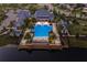 Resort-style pool with surrounding lounge chairs and clubhouse at 12232 Perennial Pl, Lakewood Ranch, FL 34211