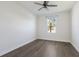 Bright bedroom with wood-look floors and a window at 12232 Perennial Pl, Lakewood Ranch, FL 34211