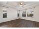 Spacious bedroom with hardwood floors and multiple windows at 12232 Perennial Pl, Lakewood Ranch, FL 34211