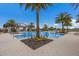 Resort-style community pool with palm trees and pavilion at 12232 Perennial Pl, Lakewood Ranch, FL 34211