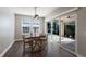 Dining room with sliding glass doors leading to pool at 12232 Perennial Pl, Lakewood Ranch, FL 34211