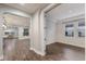 Bright hallway with hardwood floors and archways to adjacent rooms at 12232 Perennial Pl, Lakewood Ranch, FL 34211