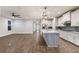 Island kitchen with granite countertops and stainless steel appliances at 12232 Perennial Pl, Lakewood Ranch, FL 34211