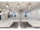 Kitchen island with granite countertop and stainless steel sink, designer lighting at 12232 Perennial Pl, Lakewood Ranch, FL 34211