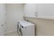 Laundry room with washer, dryer, and cabinets at 12232 Perennial Pl, Lakewood Ranch, FL 34211